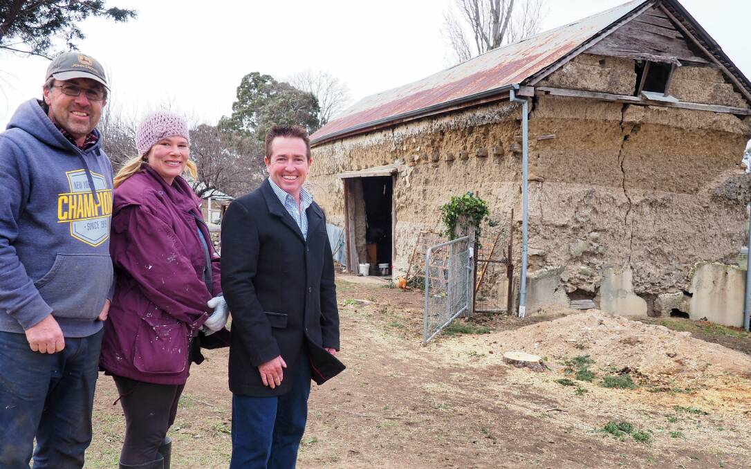 STILL STANDING: Owners Brad and Vanessa Hargans with Bathurst MP Paul Toole outside Lindlegreen Barn at OConnell. Photo: SUPPLIED