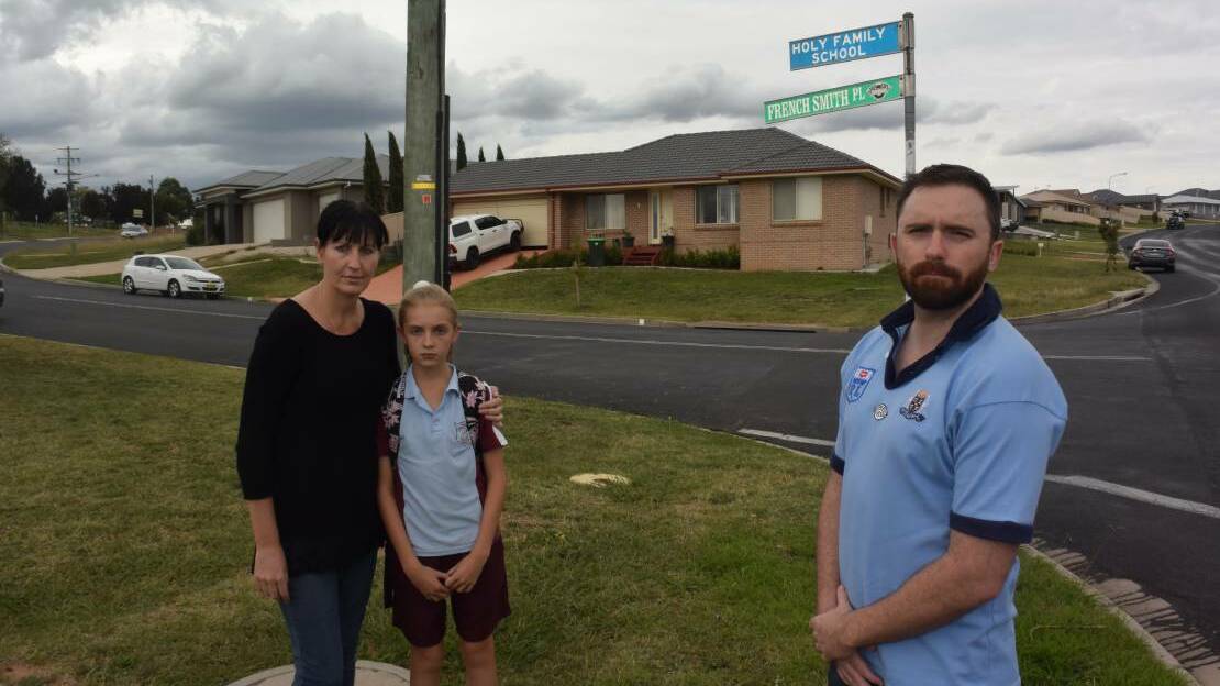 CONCERNED: Sharon Francis with her daughter Mariah Bowrey and Councillor Alex Christian on the corner of French Smith Place and Marsden Lane, near Holy Family Primary School.