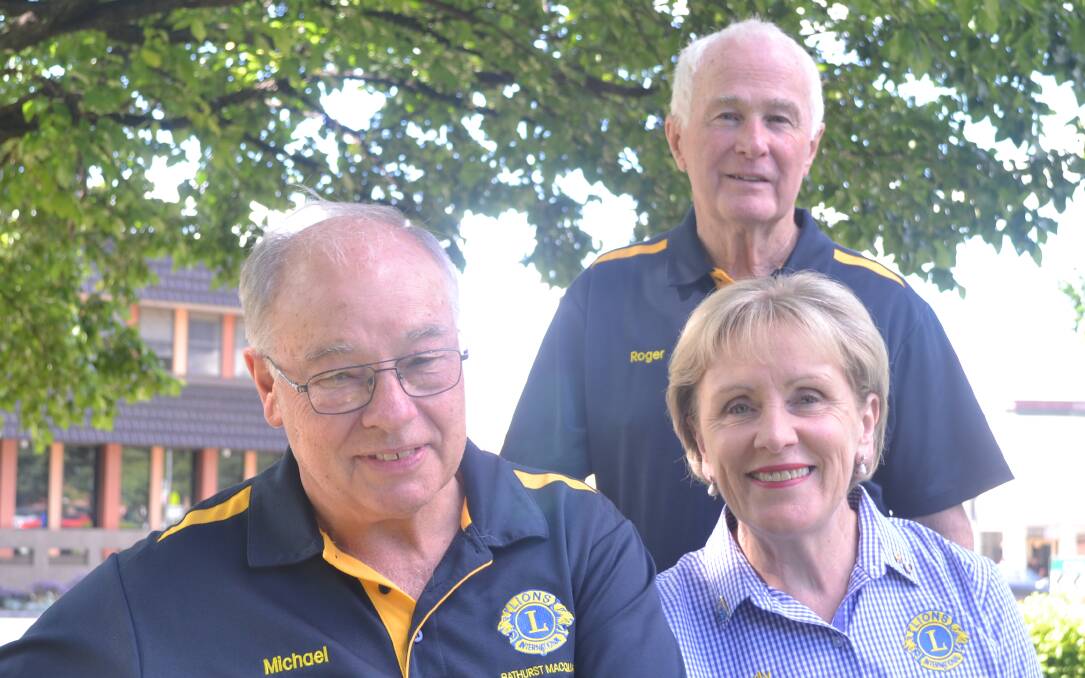 LIONS HEARTED: Bathurst Macquarie Lions Club members Michael Ryan (president), Judy Ryan and (standing) Roger Thomas.