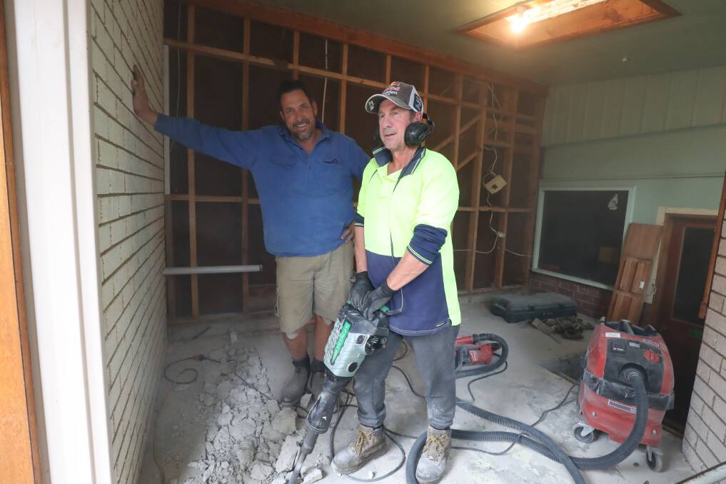 SAFE PLACE: Clinton and Jason Hunt working at the Bathurst Uniting Church site in William Street as it prepares to offer shelter for the homeless. Photo: PHIL BLATCH