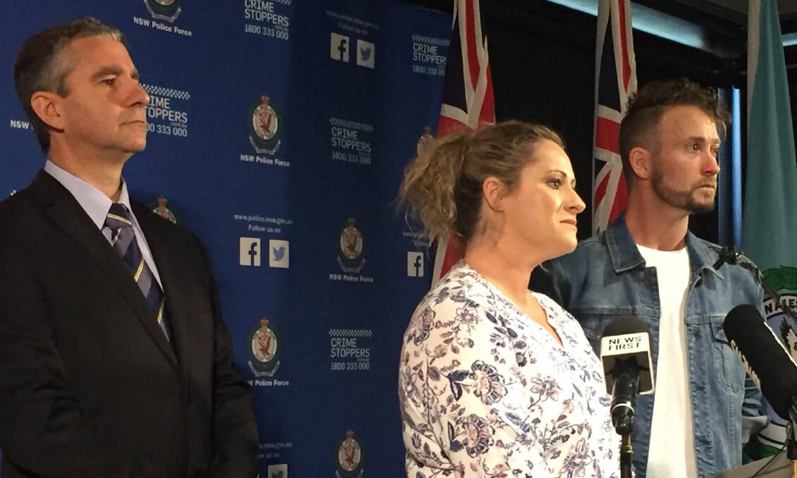 REWARD: Superintendent Scott Cook with Janine Vaughan's sister Kylie and brother Adam at a press conference in March, where police announced a $1 million reward.