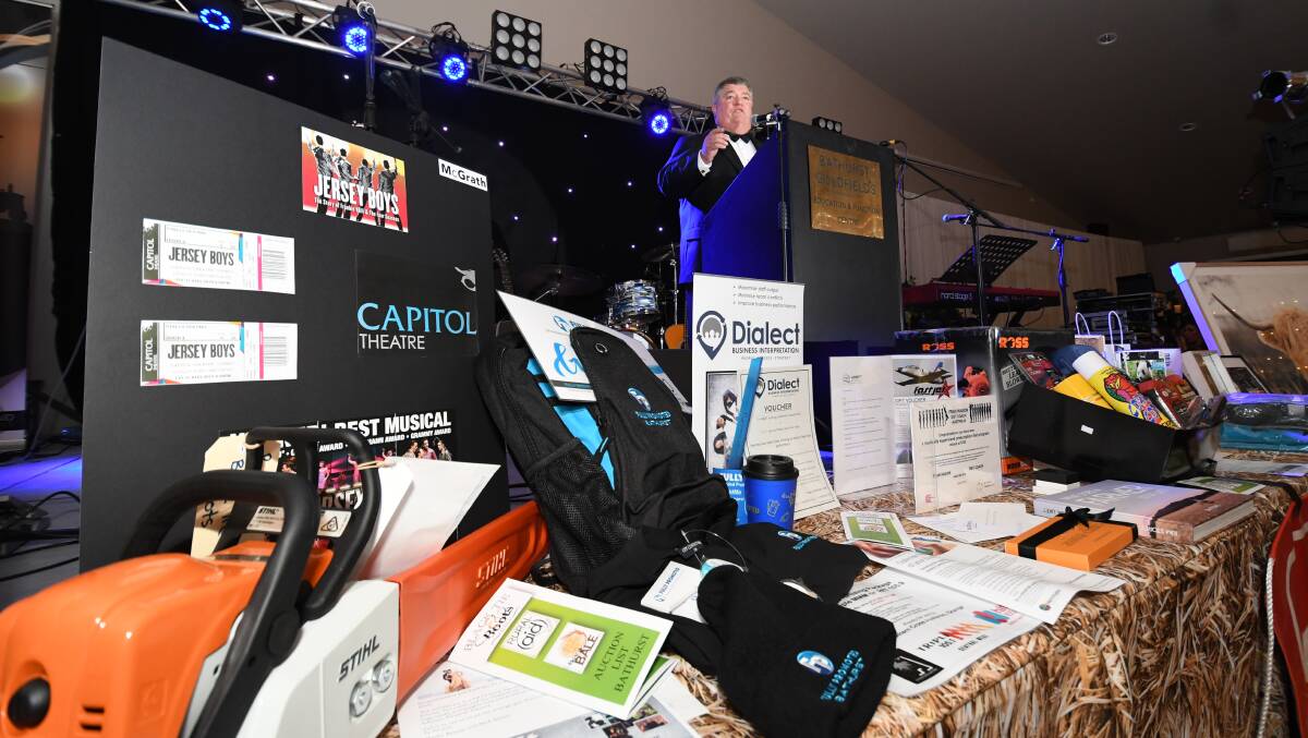 FUNDRAISER: Rural Aid CEO Charles Alder with some of the raffle items that were up for grabs at Saturday night's Black Tie and Boots Ball at Bathurst Goldfields. Photo: CHRIS SEABROOK