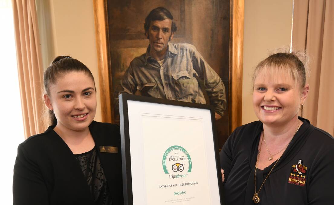 RECOGNITION: Bathurst Heritage Motor Inn receptionist Michelle Bawdon and manager Lisa Battersby with their Trip Advisor Hall of Fame certificate. Photo: CHRIS SEABROOK 081419ctripadvr