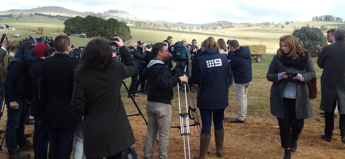 CENTRE OF ATTENTION: The media scrum made a striking scene on a large scale family farm at Newbridge on Monday. Photo: SUPPLIED