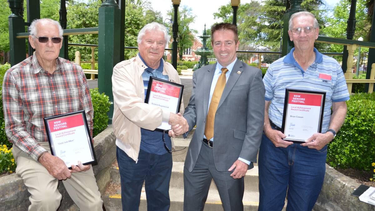 JOBS WELL DONE: Bathurst MP Paul Toole presents community service awards to Odd Jobs Men Mark Ryan (left) and Brian Cowan (right), along with Roland Auguszczak who was awarded for his service to music.