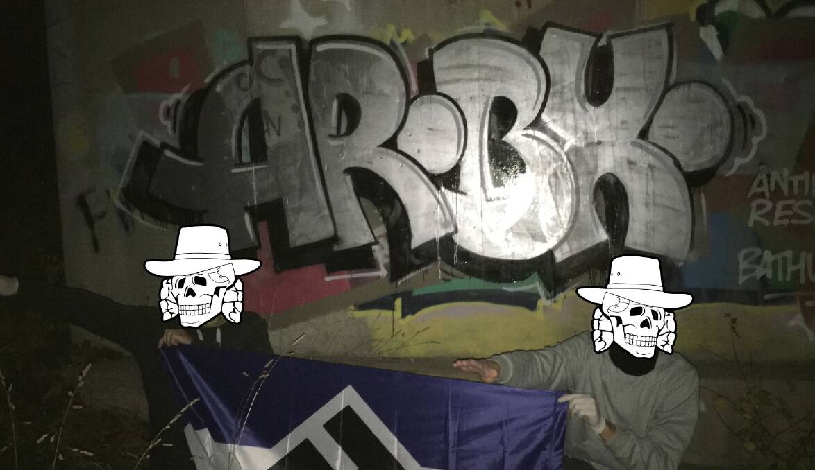 WHITEWASH: Antipodean Resistance members have blocked out their faces in this photo of graffiti promoting their cause that has been spraypainted in Bathurst during their latest visit.