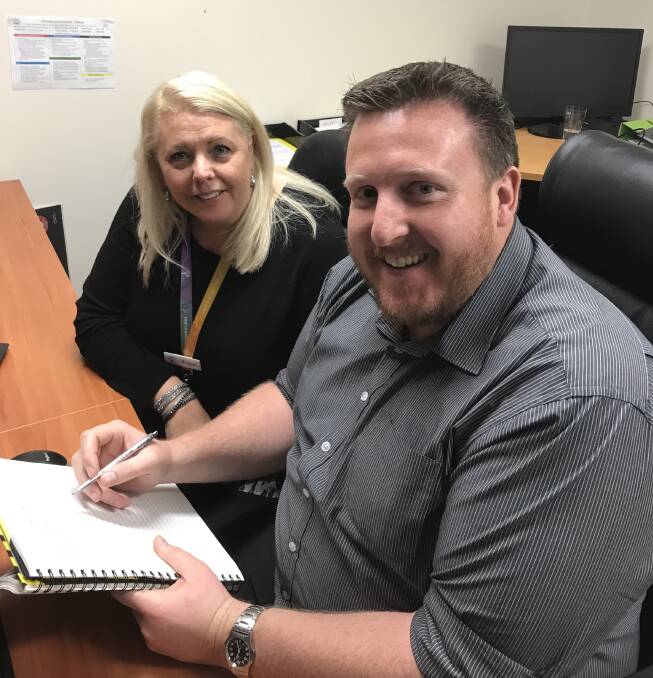 CARE PLANS: Veritas House carer recruitment officer Bridget Tracy and operations manager Joel Palmer prepare for next week’s Foster Care Week events taking place in Bathurst. Photo: SUPPLIED