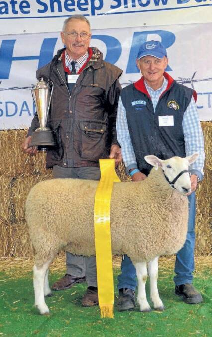 SUPREME: Peter Matus of Tara Stud at Rockley is pictured with judge Graeme Moore after Peter’s Leicester ewe won Supreme Champion Border Leicester at the NSW Sheep Show in Dubbo.
 
