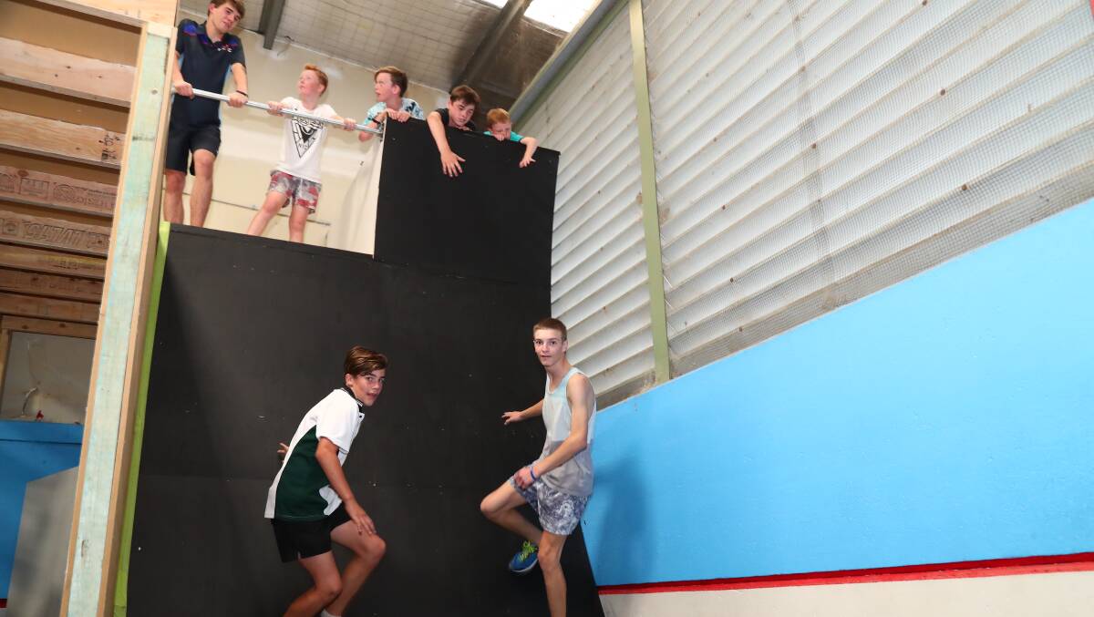 WARPED WALL: Jacob Gibbons and Alex Edward are cheered on by Jackson Hadder, Preston Turner, Chris Jackson, Harley Spice and Will Turner. Photo: PHIL BLATCH