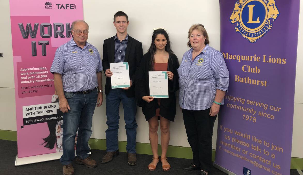 SUPPORT: Michael Ryan and Sue Longmore from Lions Club of Bathurst Macquarie with scholarship winners Adam Neale and Sarah Lavilles.