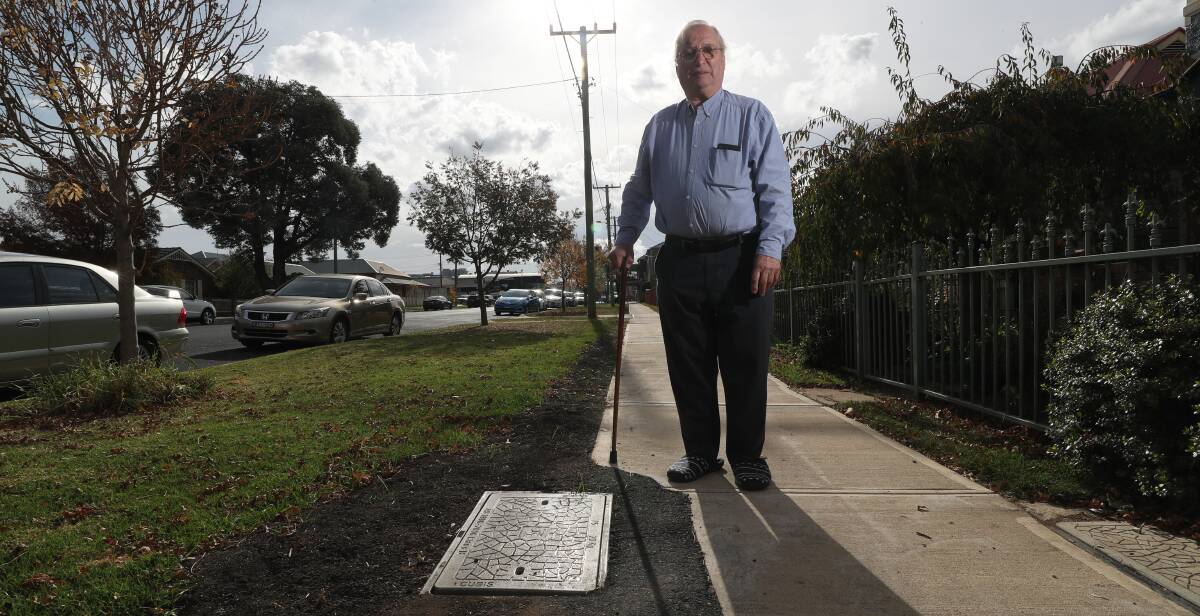 PATCHWORK: Piper Street residents Martin King is one of the people upset by the damage NBN contractors have done to local footpaths and driveways. Photo: PHIL BLATCH