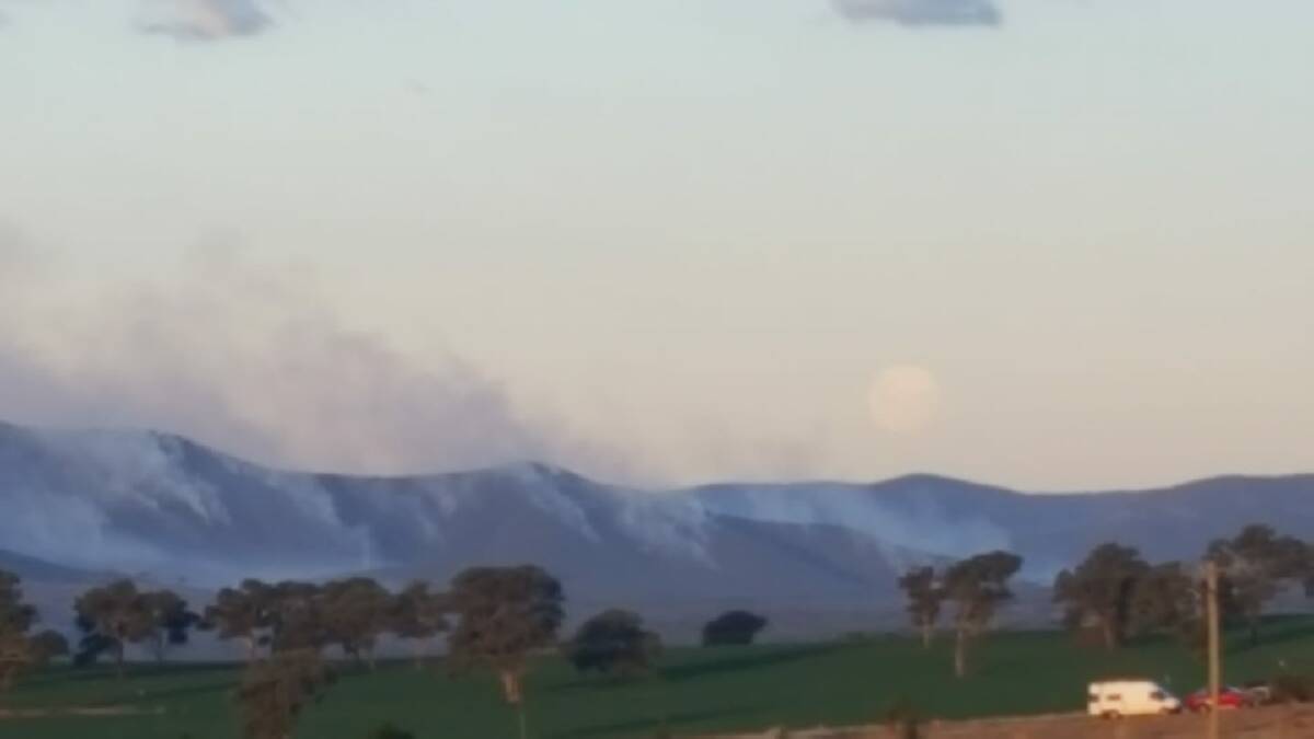 David Abernethy: The rising Moon and the burn off smoke east of Bathurst.