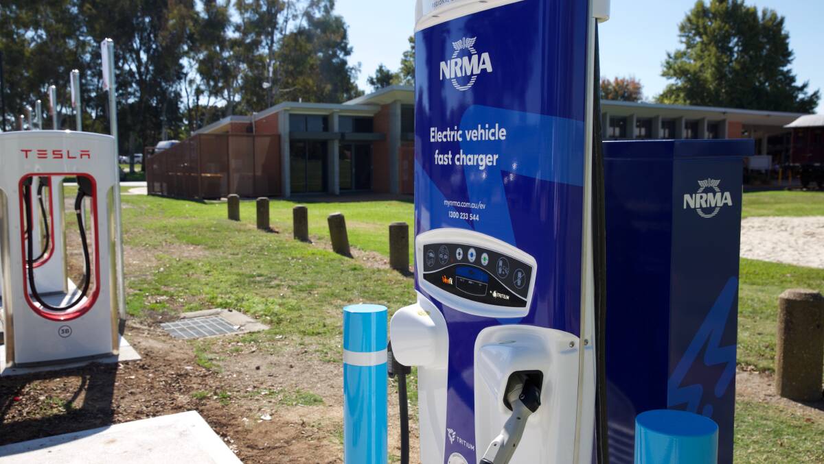 PLUGGED IN: The new NRMA fast charging station at the Bathurst Visitor Information Centre, alongside a bank of Tesla chargers.