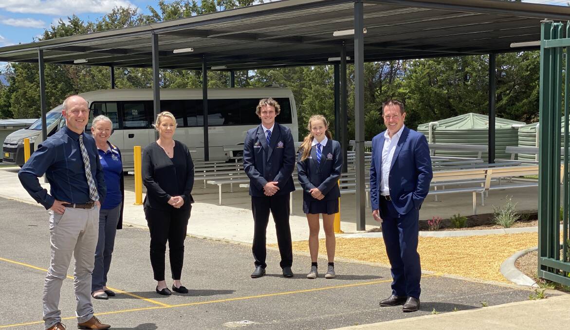 STUDENT SAFETY: Bathurst MP Paul Toole (right) with Bathurst High principal Ken Barwick, school business manager Susan Graham, deputy principal Natalie Saini and 2021 school captains Charlie Hutchings and Zoe Peters in the new bus shelter. Photo: SUPPLIED 