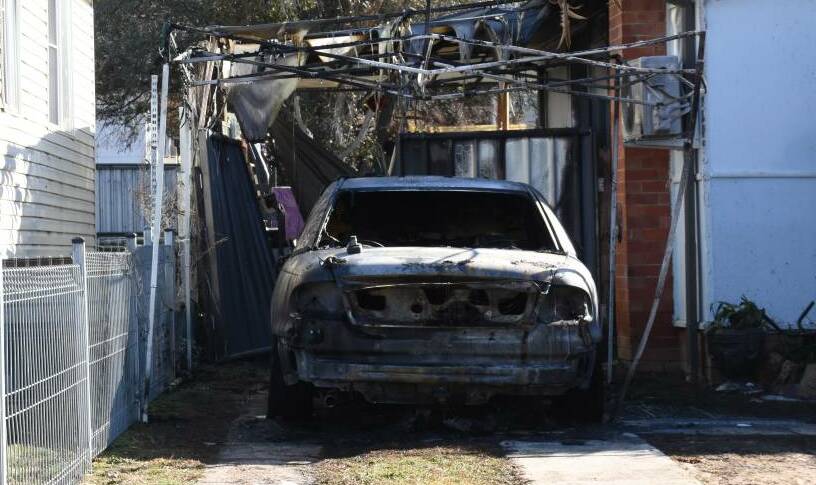 BLAZE: A Holden Commodore parked at a home on Rocket Street was destroyed by an overnight fire on Tuesday. Photo: NADINE MORTON 090319nmfire