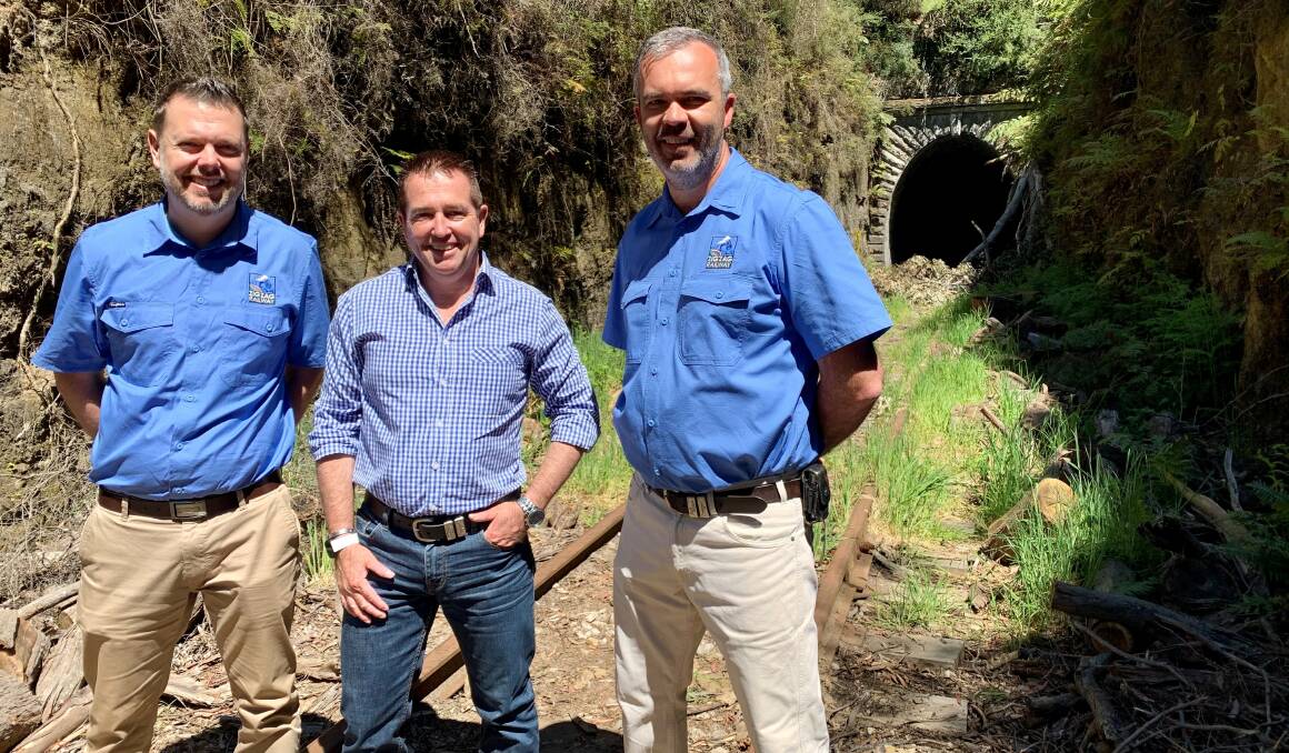 ZIG ZAG: Bathurst MP Paul Toole delivering some good news to Zig Zag Railway
volunteers Ben Lawrence, left, and Cameron McGinty. Photo: SUPPLIED