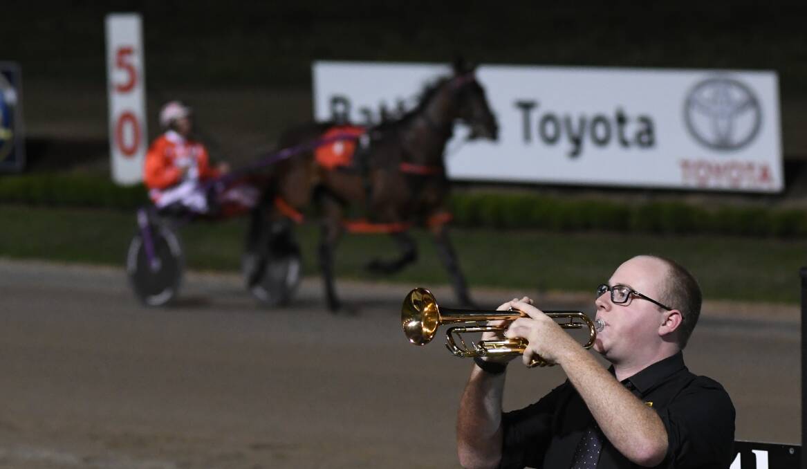 SNAPSHOT: Trumpeter Chris Dove plays The Last Post prior to the running of the Bathurst RSL Soldiers Saddle final on Saturday. Photo: CHRIS SEABROOK 121518ctrots15