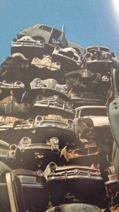 STACKS ON: Can you identify a Vauxhall, Humber, Simca, Mercury, Anglia or Customline in this tower at a wrecking yard? Photo: SUPPLIED