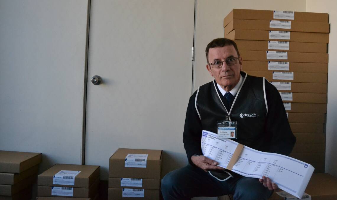 POLL POSITION: Returning officer Stuart Evennett with boxes of ballot papers for the Bathurst, Blayney and Oberon local government elections.