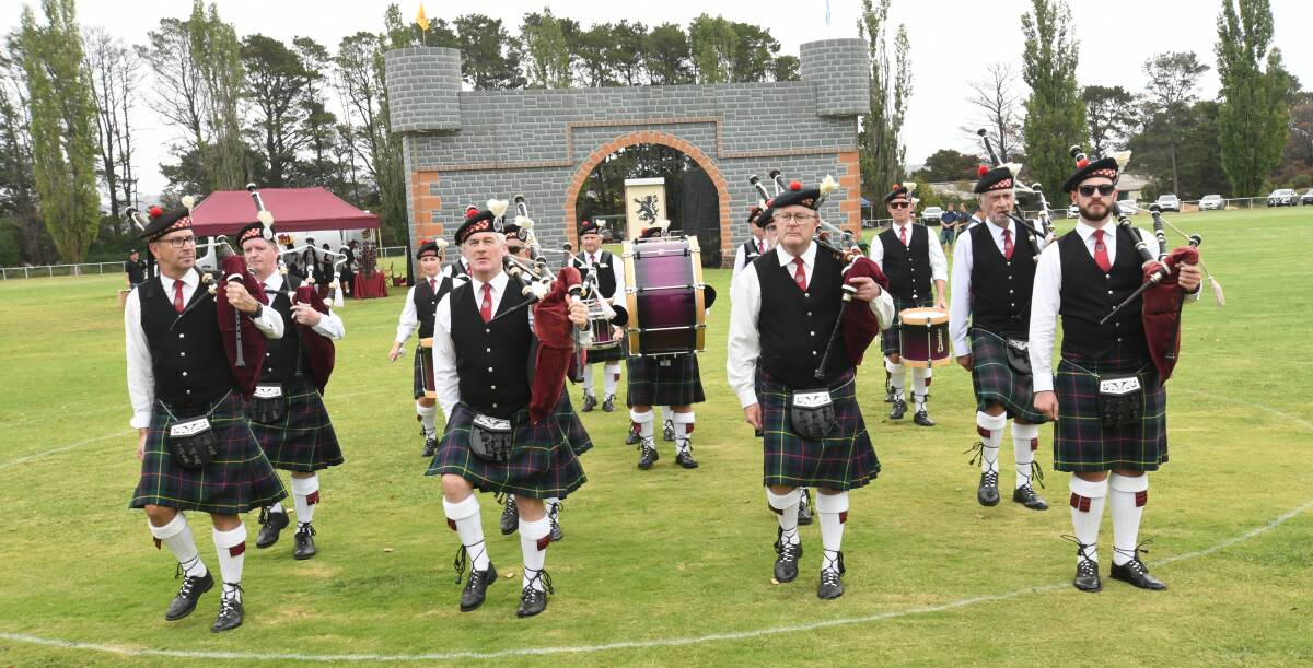 COLOUR AND MOVEMENT: The Sydney Thistle Highland Pipe Band at the Highland Gathering on Sunday. Photo: CHRIS SEABROOK 032419cscots1