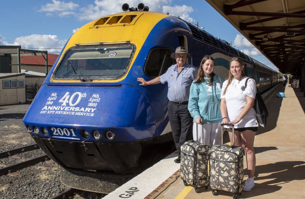 ON TRACK: Even after four decades, the XPT is still attracting new customers. NSW TrainLink regional train driver Tony Riley is pictured with first-time XPT travellers Hayley and Amber Dunn at Dubbo this week. Picture: BELINDA SOOLE