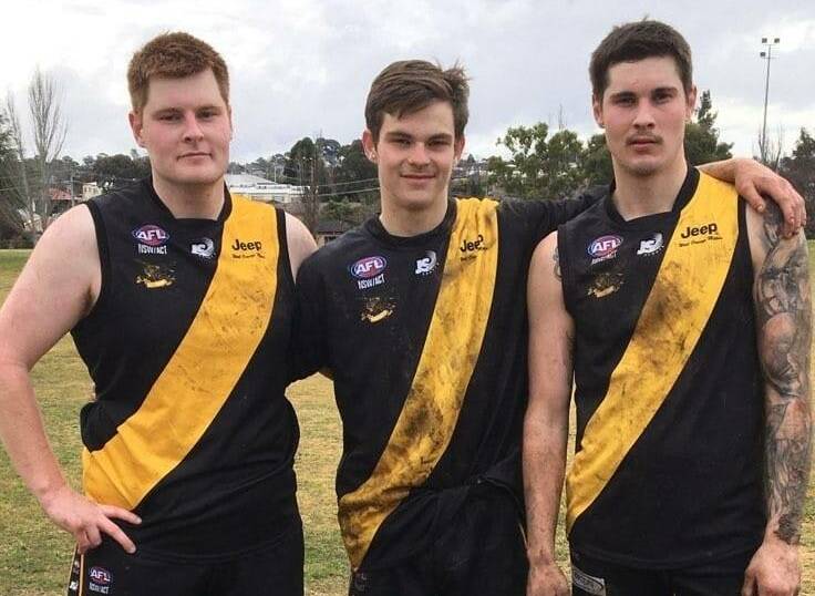 LOVED HIS FOOTY: Caleb Hannus (centre) with his brothers Jake and Tyson. The trio got to play together for the first time in 2021. Photo: SUPPLIED