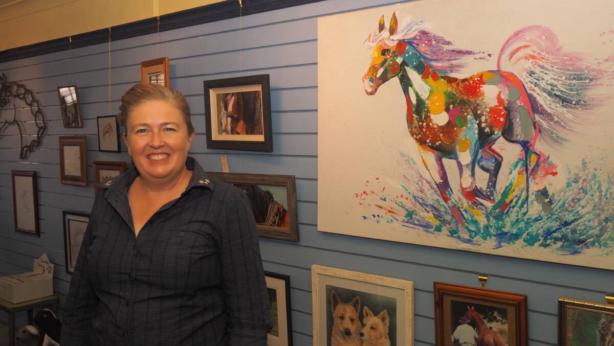 MASTERPIECES: Bathurst Tack Box proprietor Anna Blackburn with some of the works featured in the upcoming art show. Photo: SAM BOLT