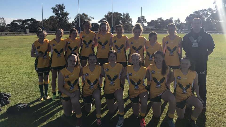 SHINING LIGHTS: The Youth Girls alongside coach Luke Le Page during their carnival win Nowra over the weekend. Photo: SUPPLIED