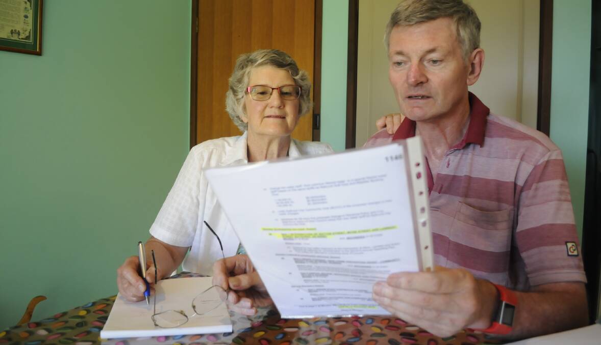 STREET BATTLE: Dianne and Kent McNab read the letter from Bathurst Regional Council containing some good news about a dangerous intersection. Photo: CHRIS SEABROOK 010317cletter1