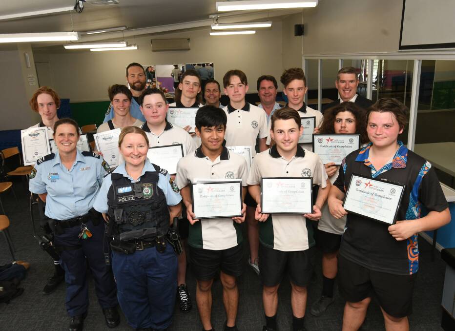 A JOB WELL DONE: Police and PCYC staff with Kelso High School's graduates from the Fit to Learn program. The group graduated on Tuesday.