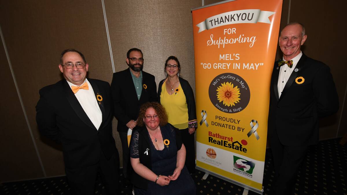 FUNDRAISERS: Melissa Johnson (centre) with Steve Semmens, Peter Johnson, Sharyn Semmens and Steve Harper at Mel's "Go Grey in May". Photo: CHRIS SEABROOK
