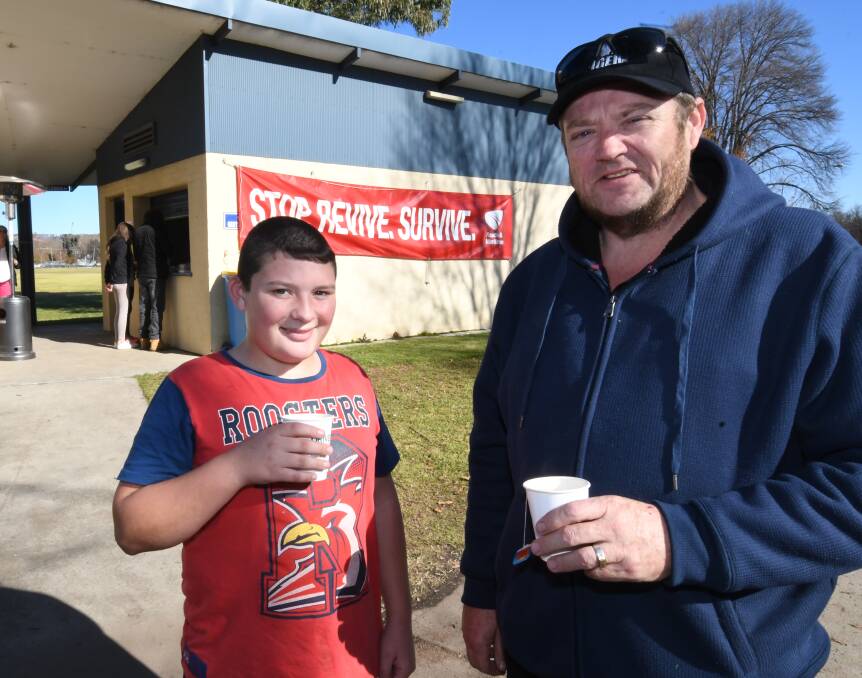 DRIVER REVIVER: Ben Stanton, 13, with his dad, Michael Stanton, from Oberon at the Driver Reviver on Monday morning.