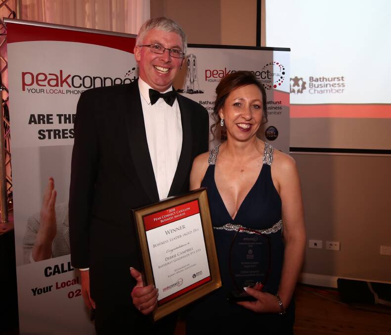 LOCAL BUSINESS CELEBRATES: Business Chamber President, Angus Edwards, with award winner Debbie Campbell from Bathurst Goldfields.