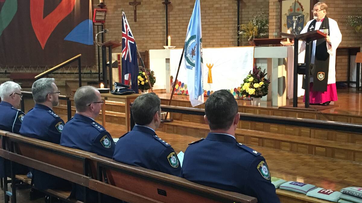 WE REMEMBER: Police chaplain, Bishop Richard Hurford, on National Police Remembrance Day at All Saints' Cathedral, Bathurst, in 2016. Photo: NADINE MORTON.
