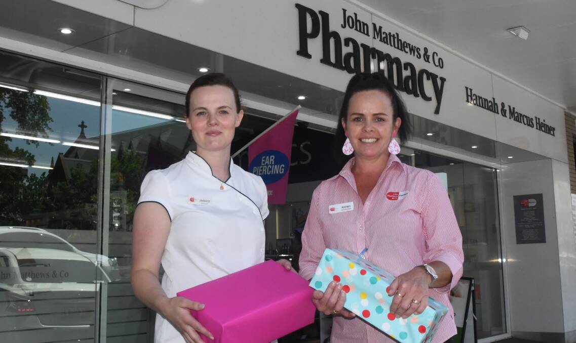 HELPING OUT DROUGHT STRICKEN COMMUNITIES: Pharmacist Jessica Morgan-Thomas with pharmacy manager, Karen Carter, with donated presents.