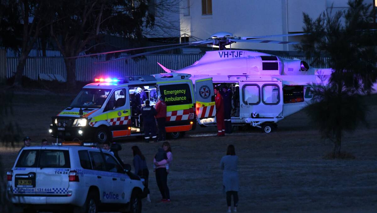 EMERGENCY: The Toll helicopter on scene at Hector Park with other emergency services late on Sunday evening. Photo: CHRIS SEABROOK