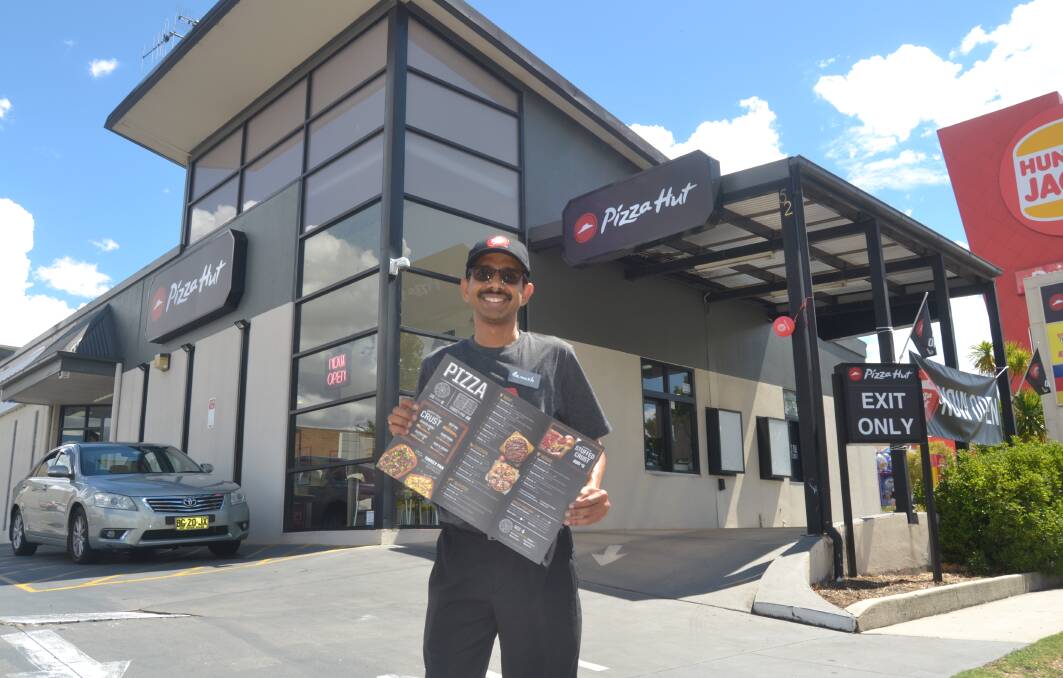 NEW NAME: Franchisee Ramesh Atluri in front of the former Eagle Boys outlet which was rebranded as Pizza Hut earlier this week. Photo: JACINTA CARROLL