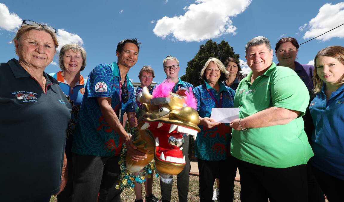 DONATION: Bathurst Pandragons, pictured with figurehead Esmarelda were highest fundraisers at the Mighty Murray challenge.