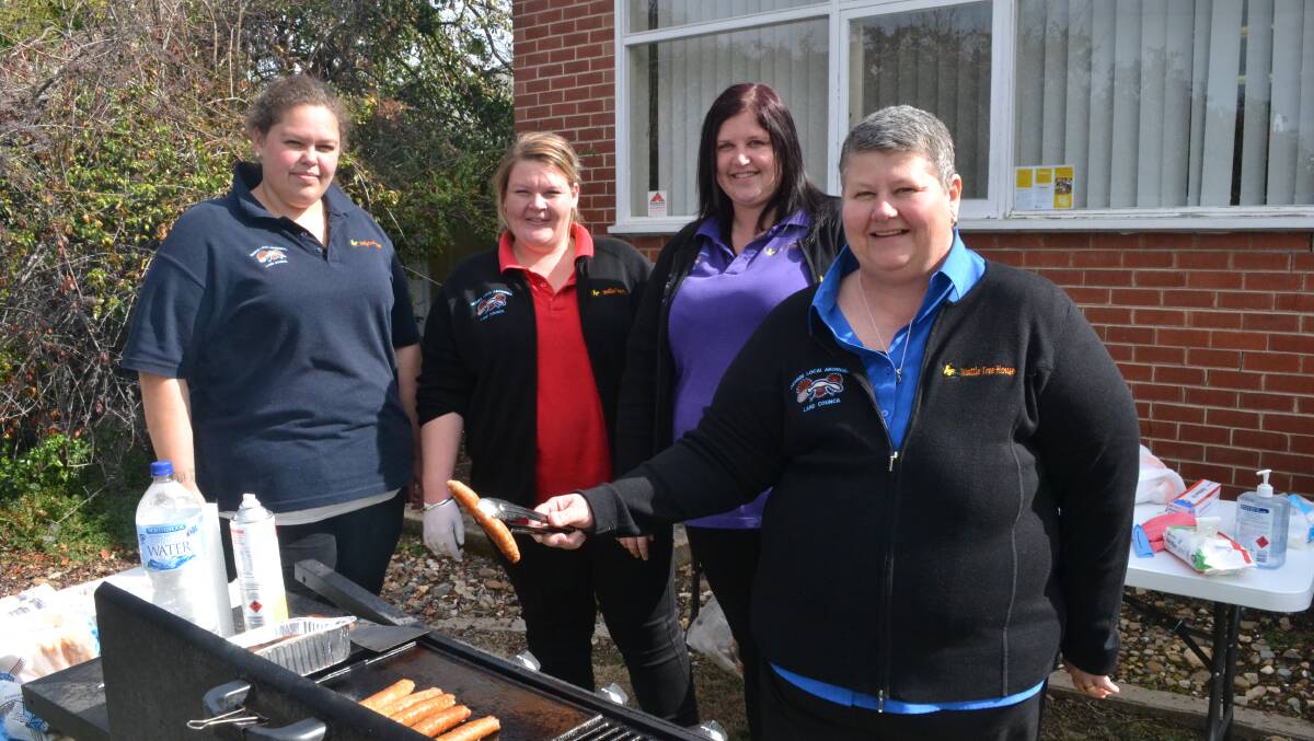 HELPING HAND: Danielle Trudgett, Bec Anderson, Lindsay Wallace and team leader Ange Brown, all from Wattle Tree House, at the barbecue.