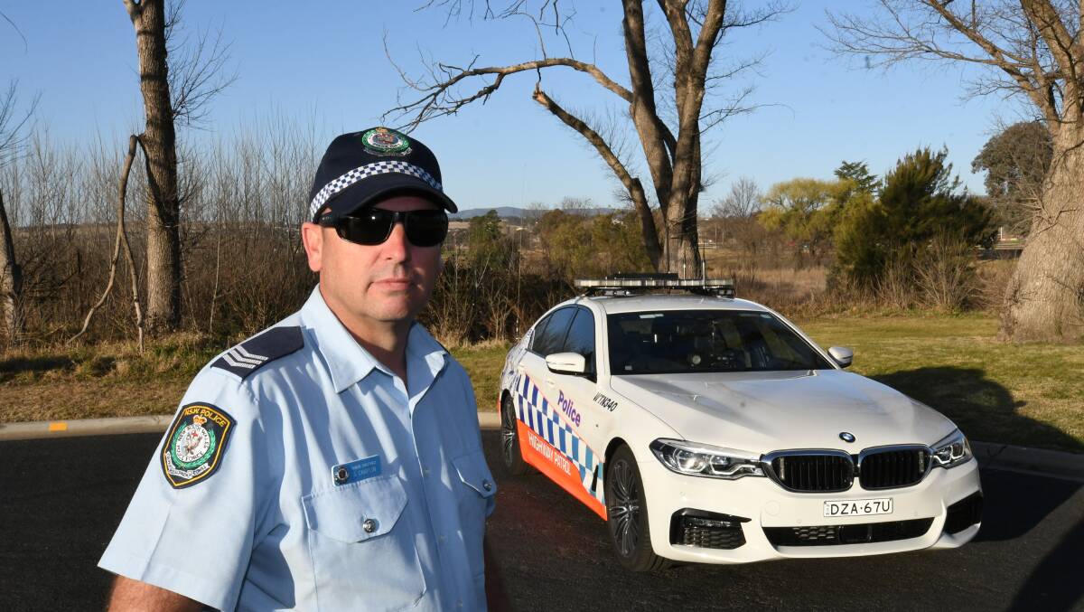 TOWARDS ZERO: Sergeant Steve Chaplin with one of the highway patrol vehicles.