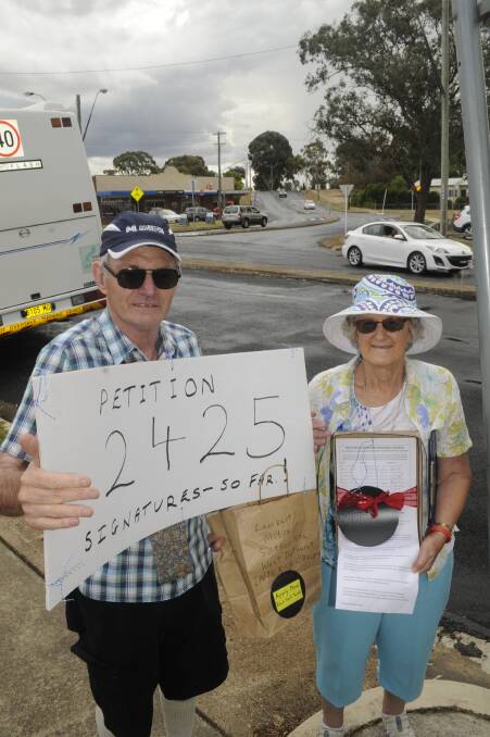 FIGHTING ON: Kent and Dianne McNab have collected almost 2500 signatures for a petition for council to address the Suttor Street, Mitre Street intersection. Photo: CHRIS SEABROOK 022817cpetitn1