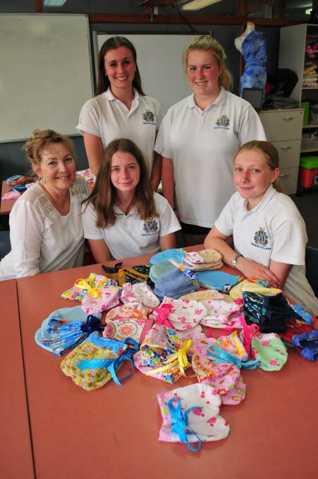 GREAT CAUSE: Bathurst High textile's teacher Chris Hickey with students Isabelle Smith, Samantha Clarke, and at front Joely Anderson and Paige Hindmarch.