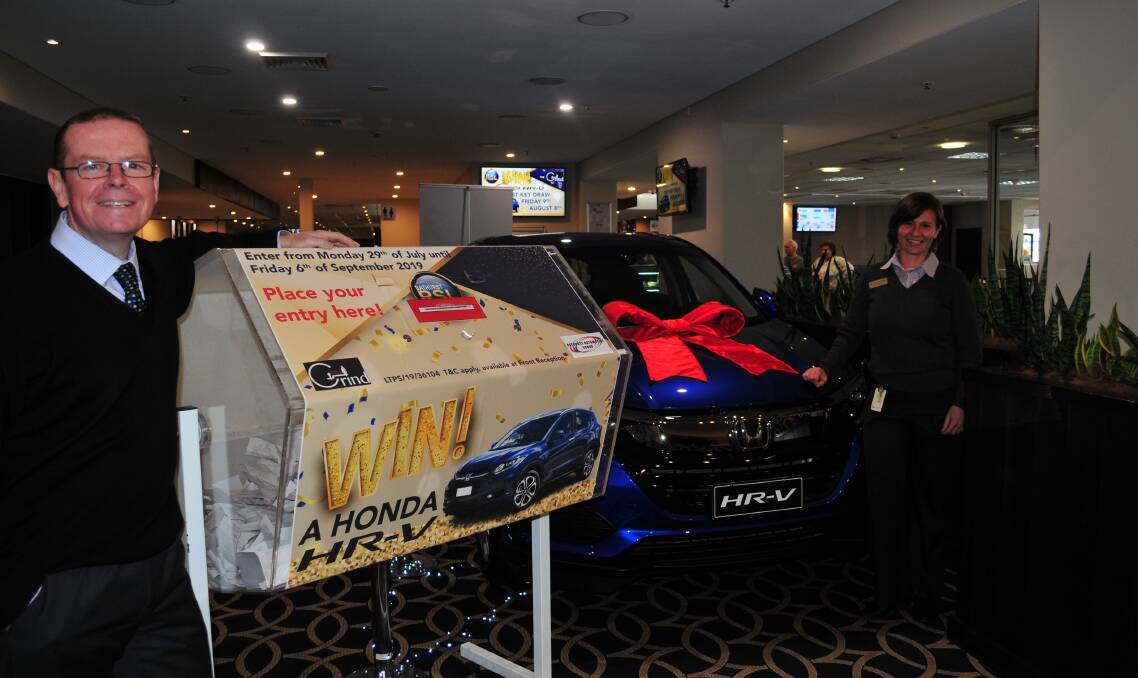 WIN A CAR: RSL General Manager, Peter Sargent, and marketing manager Janneke van der Sterren with the car that will be given away at the RSL.