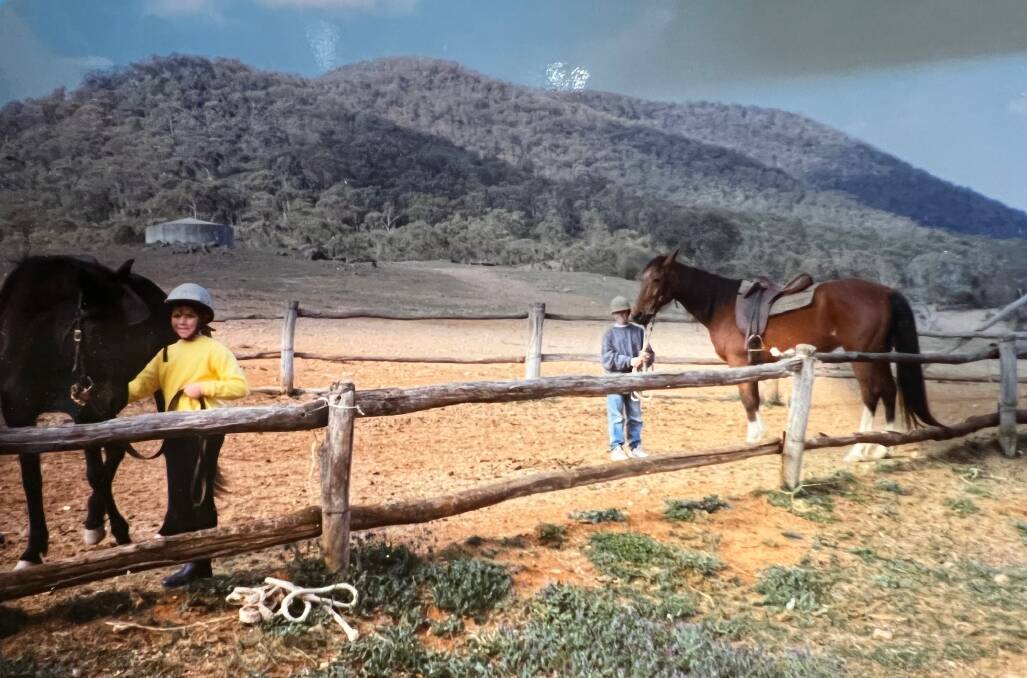 FLASHBACK: Sasha and her sister pictured in the yard built by their dad, so they could ride their horses to Sofala Public School back in 1992.