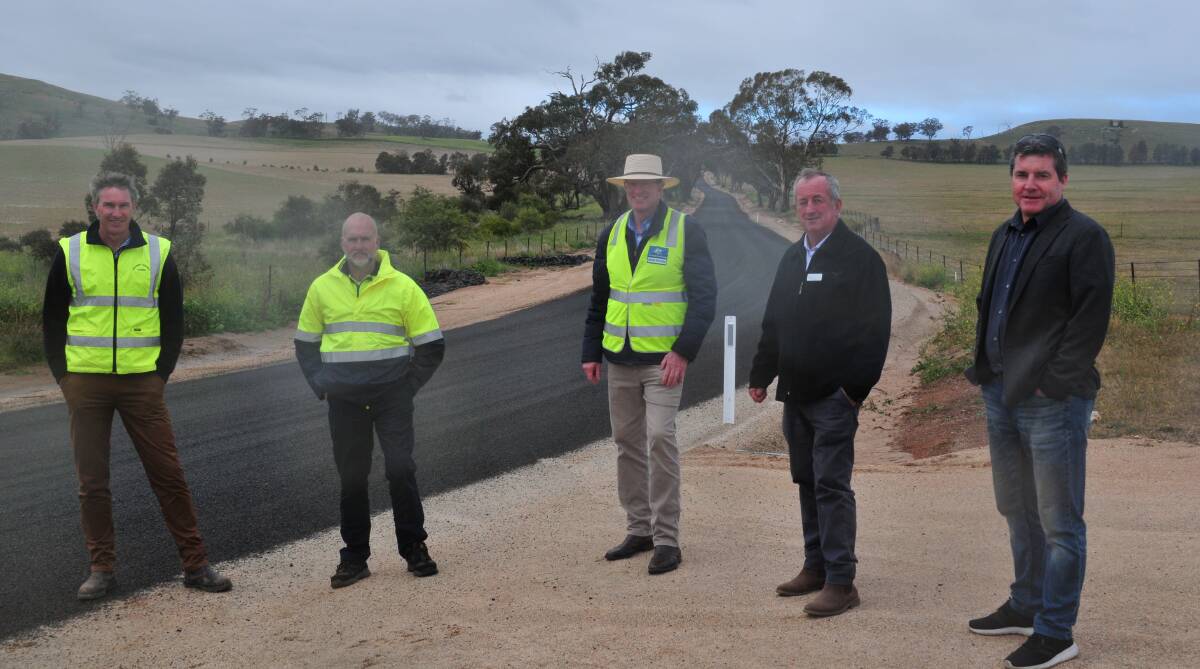 ROADS TO RECOVERY: Simon Armitage, Bathurst Regional Council, deputy mayor Ian North, Federal Member Andrew Gee, Mayor Bobby Bourke and Cr Warren Aubin, at the newly sealed section of Hen and Chicken Lane.