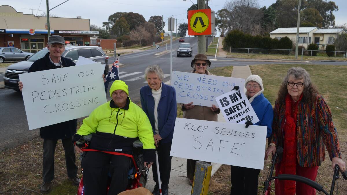 SAVE THE CROSSING: Kent McNab, Bob Triming, Shirley Jackson, Dianne McNab, Kaye Triming and Inez Funnell at the crossing in Suttor Street.
