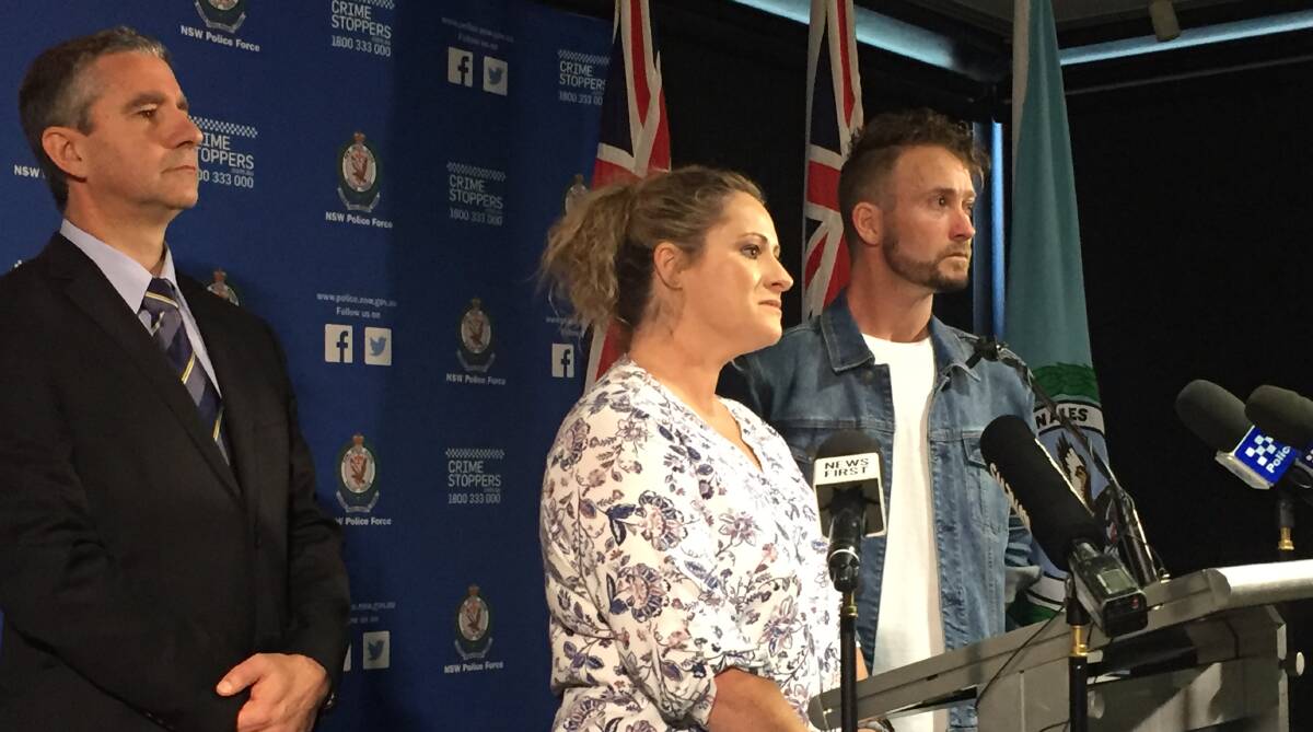 REWARD: Superintendent Scott Cook with Janine Vaughan's sister Kylie and brother Adam at a press conference in March, where police announced a $1 million reward.
