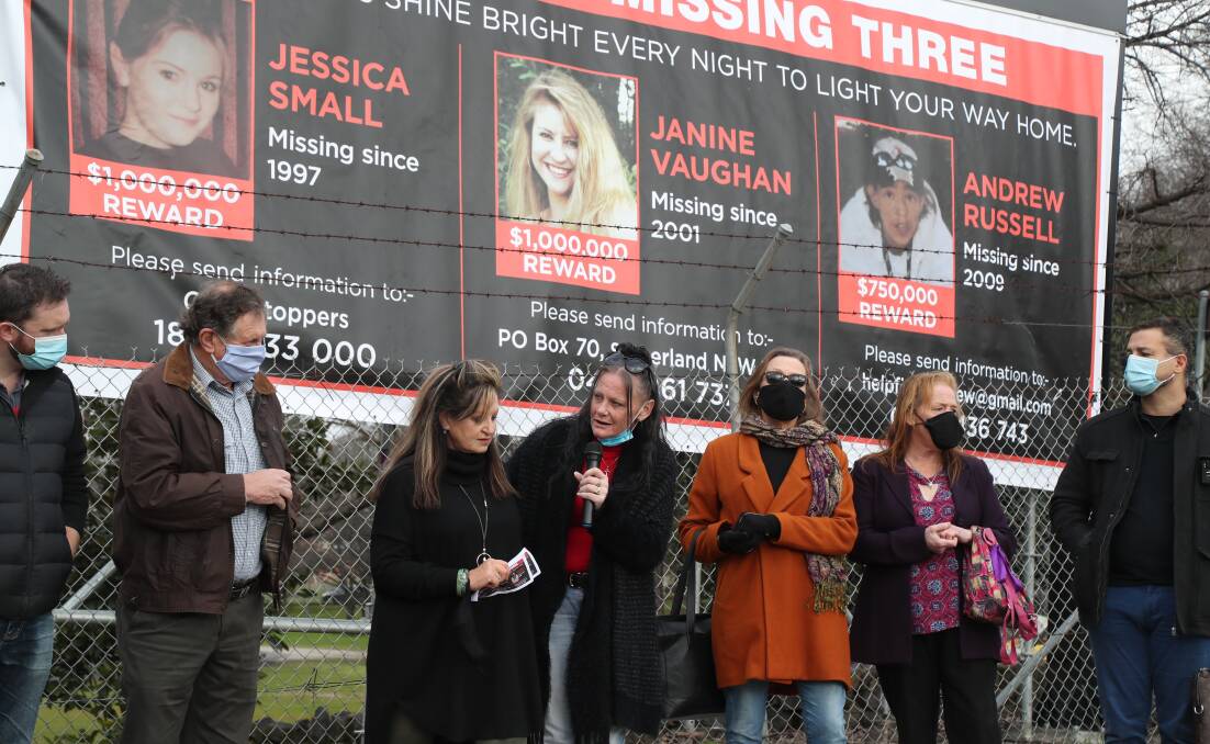 FLASHBACK: The families of Jessica, Janine and Drew pictured during Missing Persons Week, August 2021, when the banner was revealed.