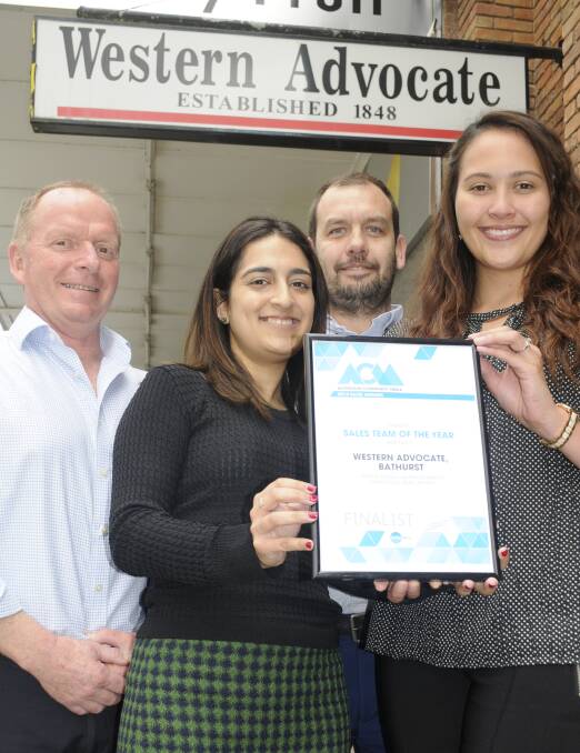 WINNERS ARE GRINNERS: Advertising manager Nils Gustafson (left) with the sales team Rahila Merchant, Martin Russell and Monika Malcolm. Photo: CHRIS SEABROOK
