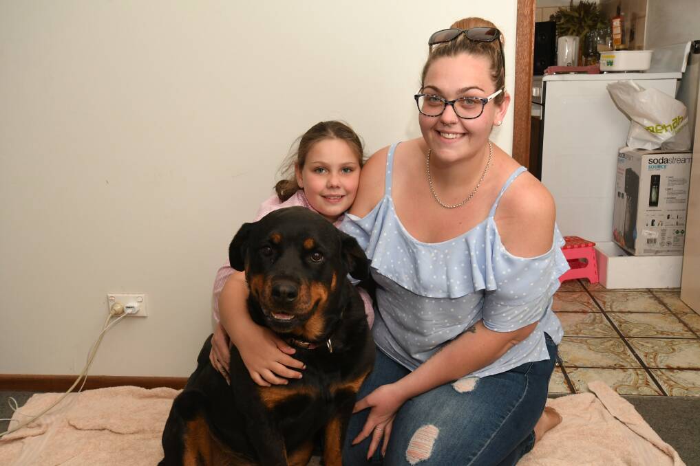 BE AWARE: Kiya Colebrook with her daughter, Ayla (7) and 'Kahlua'. They are warning pet owners to be aware. Photo : 121019cbaited1